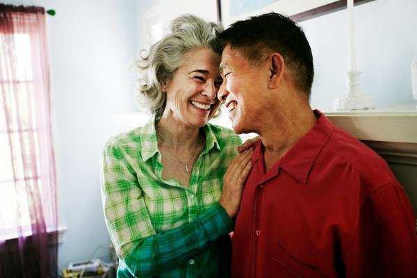 Couple smiling in living room